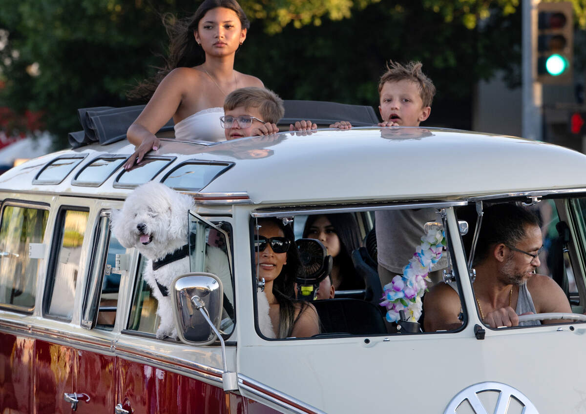 A family drives down McHenry Avenue in a 1960’s era Volkswagen bus during the American Graffiti Parade in Modesto Friday, June 12, 2026. The parade is organized by the North Modesto Kiwanis Club featuring 1,000 classic cars.